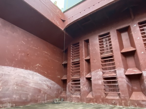 Inside a bulk carrier cargo hold during an inspection